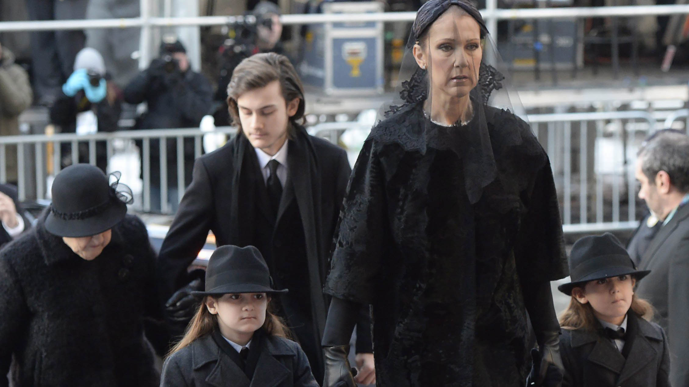 Celine Dion arrives with sons Eddy and Nelson at Montreal's Notre-Dame Basilica on Friday, January 22, 2016 for the funeral of her late husband Rene Angelil, who died of throat cancer last week at the age of 73. THE CANADIAN PRESS/Ryan Remiorz