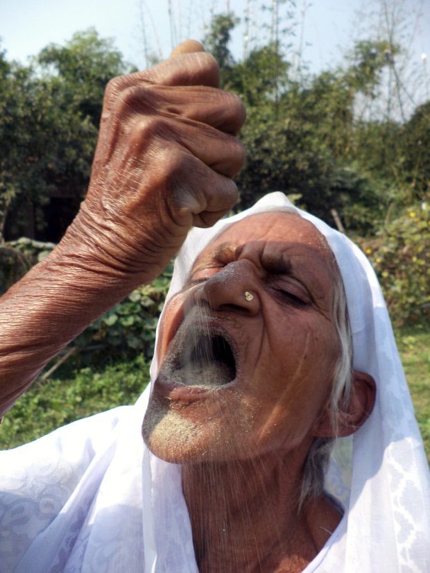 PIC FROM Caters News - (PICTURED: Kusma Vati, 78 eating sand) - An elderly woman from Varanasi, India, has eaten sand and gravel for the last six decades and claims the unique diet has been key to her good health. Kusma Vati, 78, is so addicted to eating sand and gravel that she spends hours in search of her staple diet and if she has no luck, she will even nibble on the walls of her own house. Her bizarre taste for stone has stunned everyone in her area of the city yet the granny claims it is because of sand and gravel that she has never felt sick. SEE CATERS COPY.
