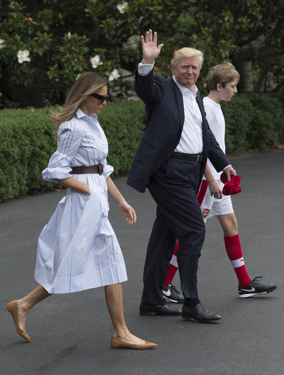 US President Donald J. Trump walks to Marine One with first lady Melania and their son Barron, as they depart the White House for Camp David, in Washington, DC, USA, 17 June 2017.